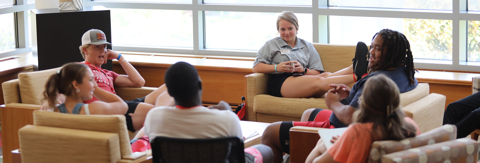 A group of students relax in Lewis Library while they relax