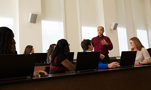 Mathematics professor teaching a class in Corn Auditorium