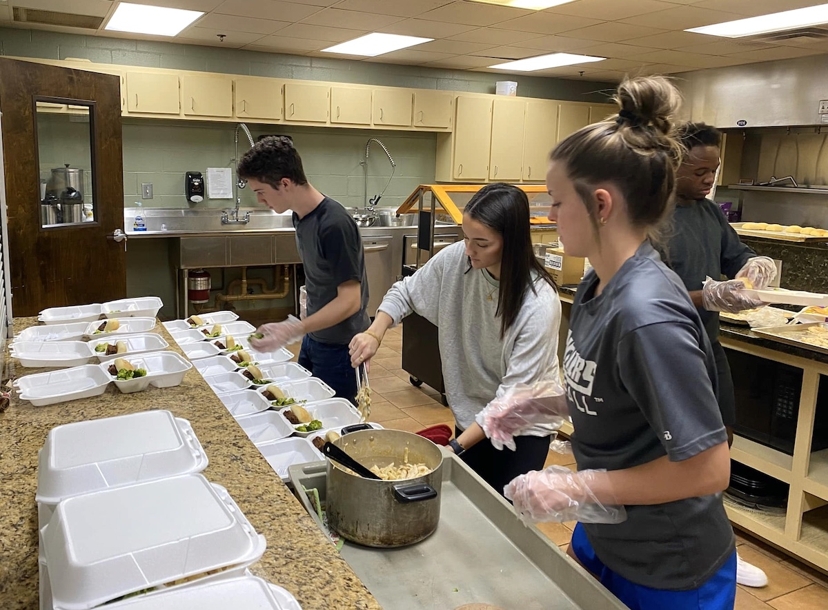 Students preparing meals at student-led soup kitchen