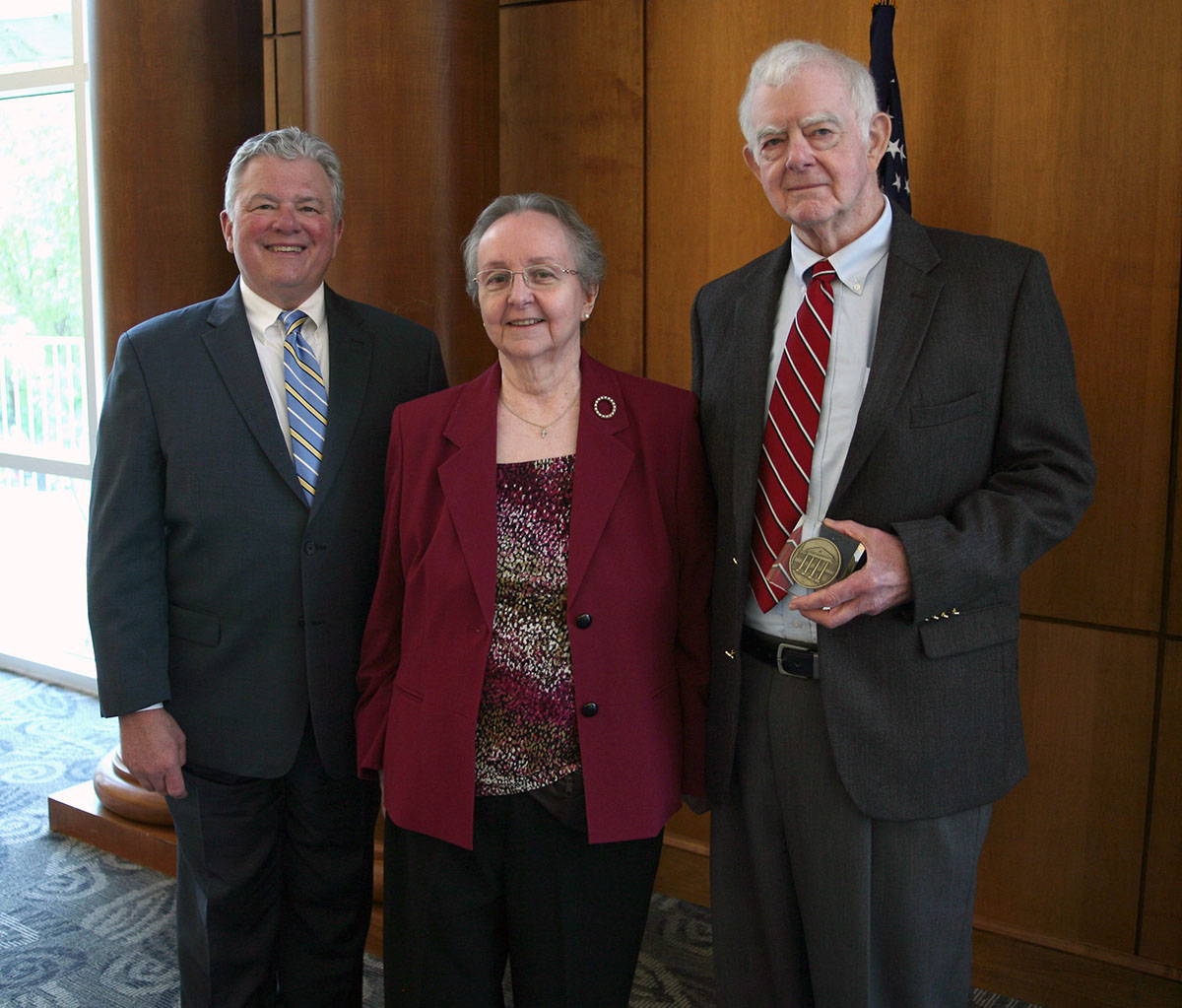 {Bruce and Emily Herrington receive their Quadrangle Society award from LC President Dan McAlexander in 2019.}